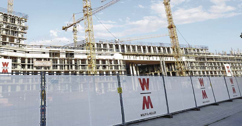 Das Firmenlogo von Wolff & Müller ist bundesweit auf Baustellen zu sehen.   (Foto: Wolff & Müller)